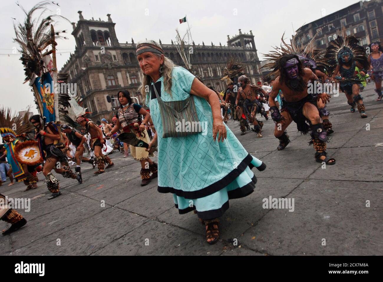 Dancers perform pre-Hispanic dances during the celebration of 687th anniversary of the foundation of Mexico-Tenochtitlan at Zocalo square in Mexico City July 26, 2012. Tenochtitlan, sometimes also known as Mexico Tenochtitlan, was a Nahua altepetl (city-state) that located on an island in Lake Texcoco, in the Valley of Mexico. Founded in 1325, it became the capital of the expanding Aztec Empire in the 15th century. Today the ruins of Tenochtitlan are located in the central part of Mexico City. REUTERS/Edgard Garrido(MEXICO - Tags: ANNIVERSARY SOCIETY) Stock Photo