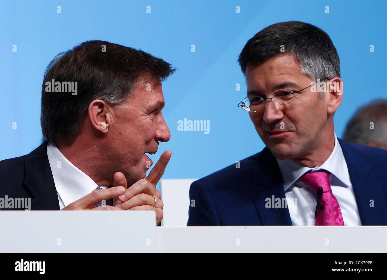 Herbert Hainer, chief executive officer of Adidas, the world's second  largest sports apparel firm, and chief financial officer Robin Stalker (L)  arrive for the company annual general meeting in the northern Bavarian