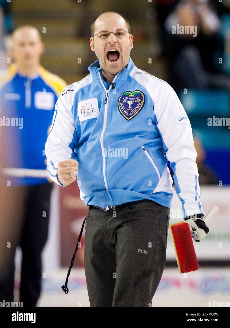 Team Quebec skip Jean-Michel Menard celebrates defeating team Alberta after  their draw during the 2014 Tim Hortons Brier curling championships in  Kamloops, British Columbia March 7, 2014. REUTERS/Ben Nelms (CANADA - Tags: