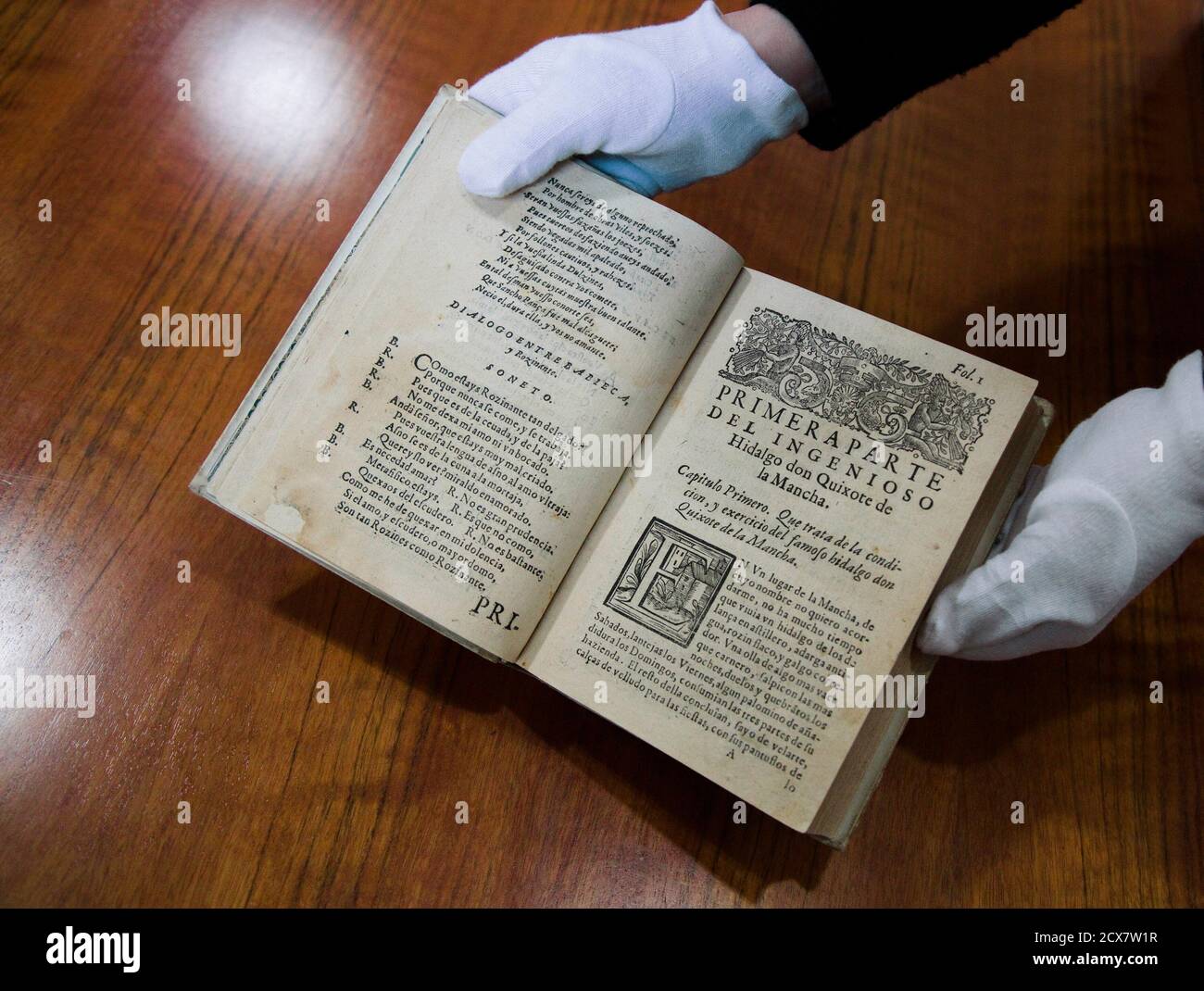 An edition dated in 1605 of Miguel de Cervantes famous novel 'Don Quixote'  is shown by a librarian at the National Library in Madrid March 10, 2014.  Historian Fernando Prado says he