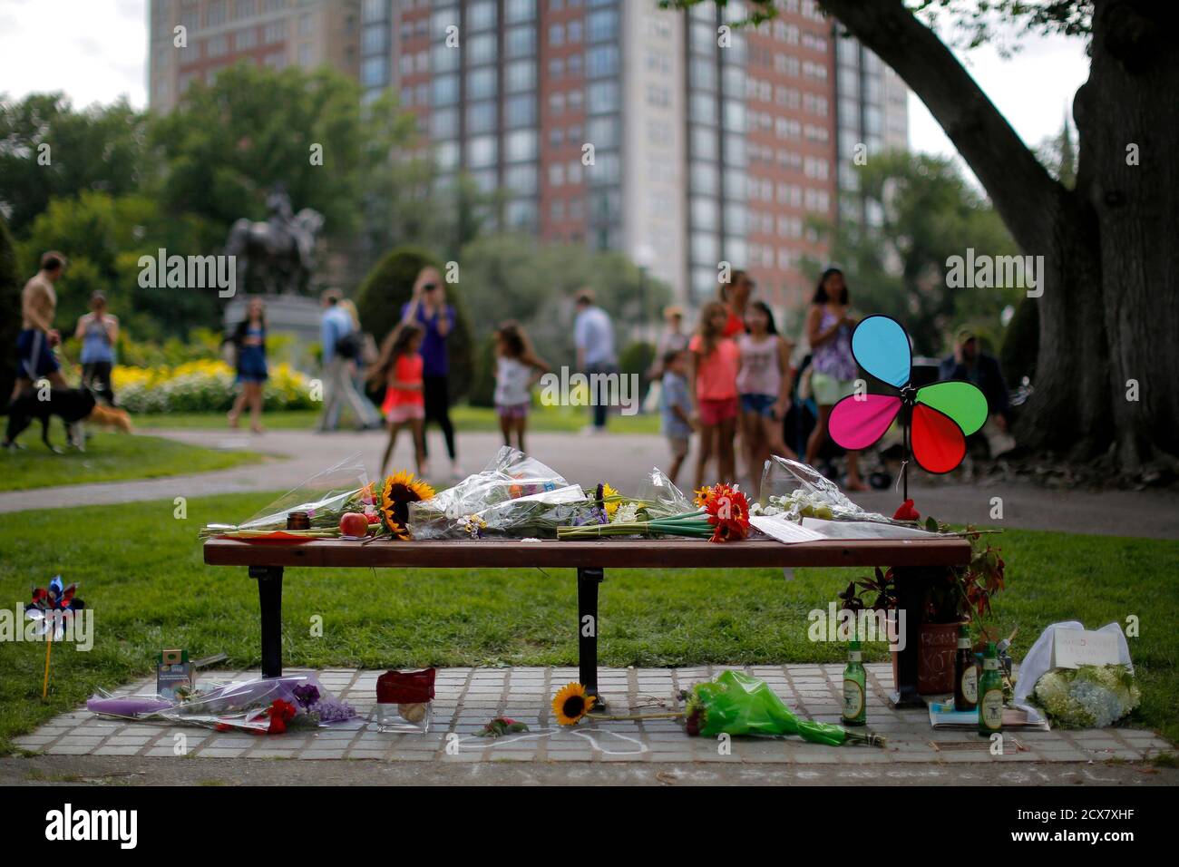 Flowers and remembrances are left in memory of actor Robin Williams on a  bench that was the site of a scene in the movie 