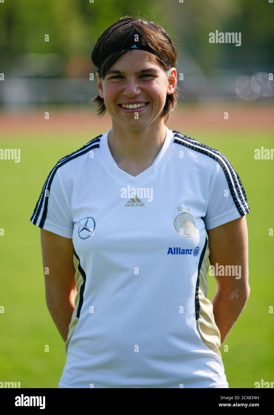 Ariane Hingst of Germany's women's soccer team poses during the official  team photo session in Cologne April 18, 2011. The German team is the  defending champion in the FIFA Women's World Cup