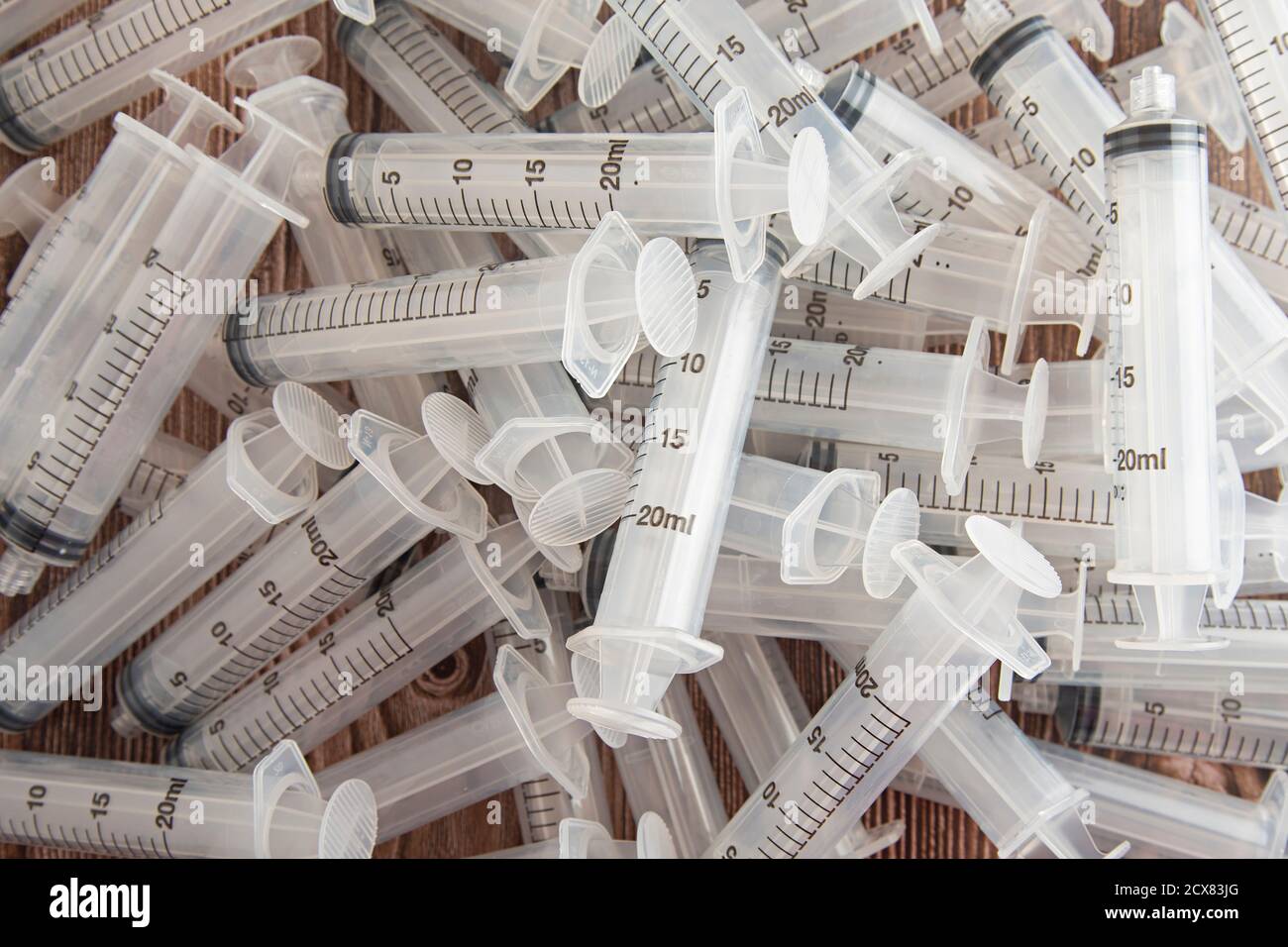 background with plastic syringes, recycling, medicine Stock Photo Alamy