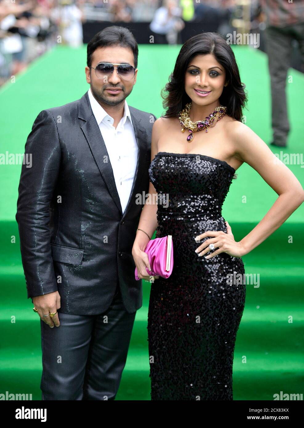 Bollywood actress Shilpa Shetty and husband Raj Kundra arrive on the green carpet during the International Indian Film Academy (IIFA) Awards in Toronto June 25, 2011. REUTERS/Mike Cassese (CANADA - Tags: ENTERTAINMENT) Stock Photo
