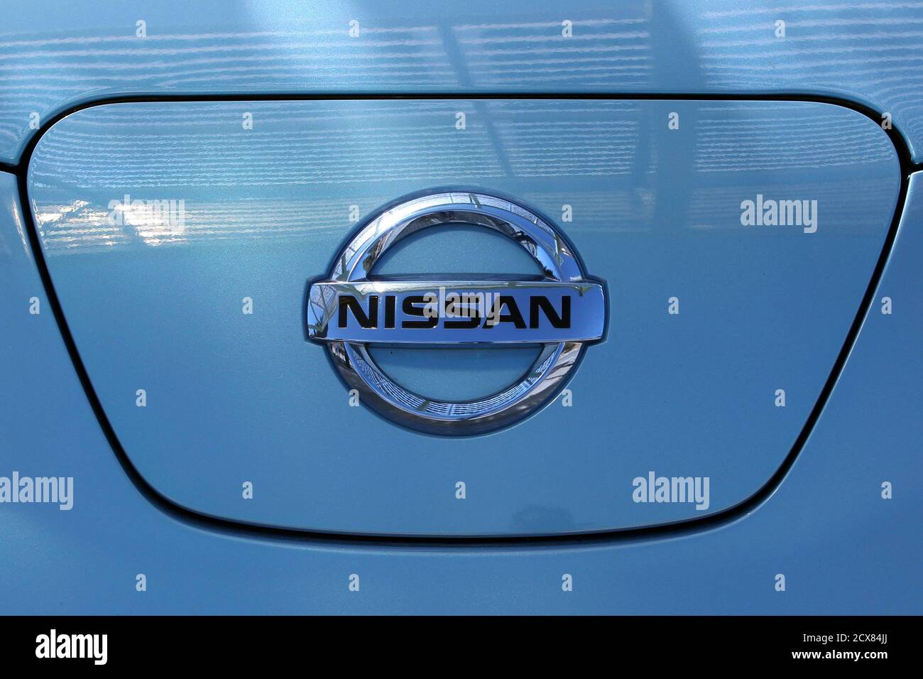 The logo of Nissan is displayed on the Nissan Leaf, an electric car, during  the opening of the first solar charging station for electric cars at El  Hassan Science City in Amman
