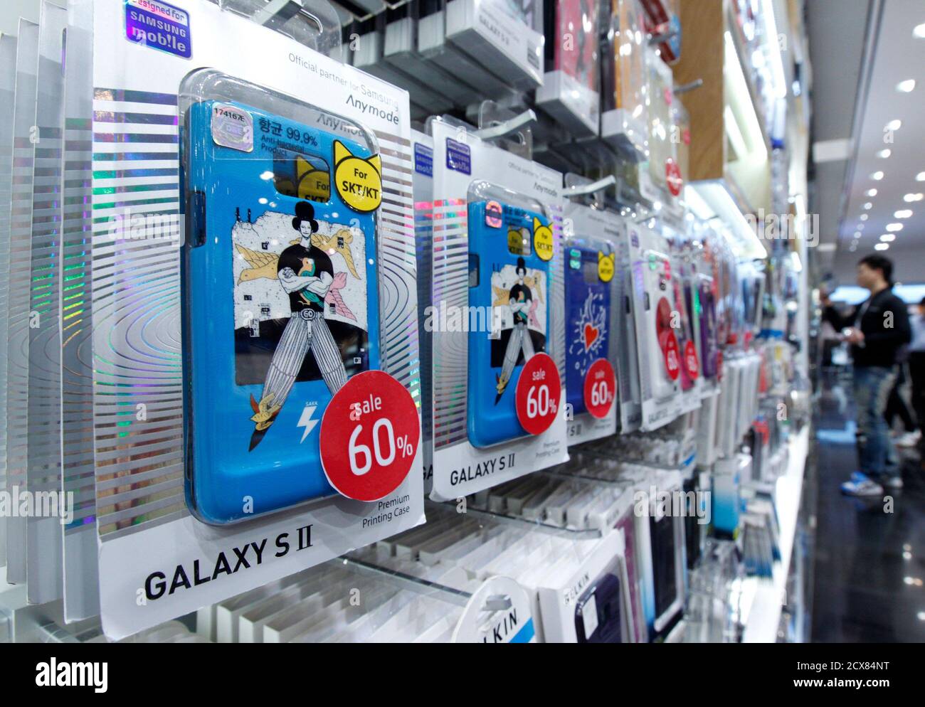 A customer looks accessories for the Samsung Electronics' Galaxy S II smartphone at a shop at the company's headquarters in Seoul October 28, 2011. Samsung Electronics Co overtook Apple Inc as