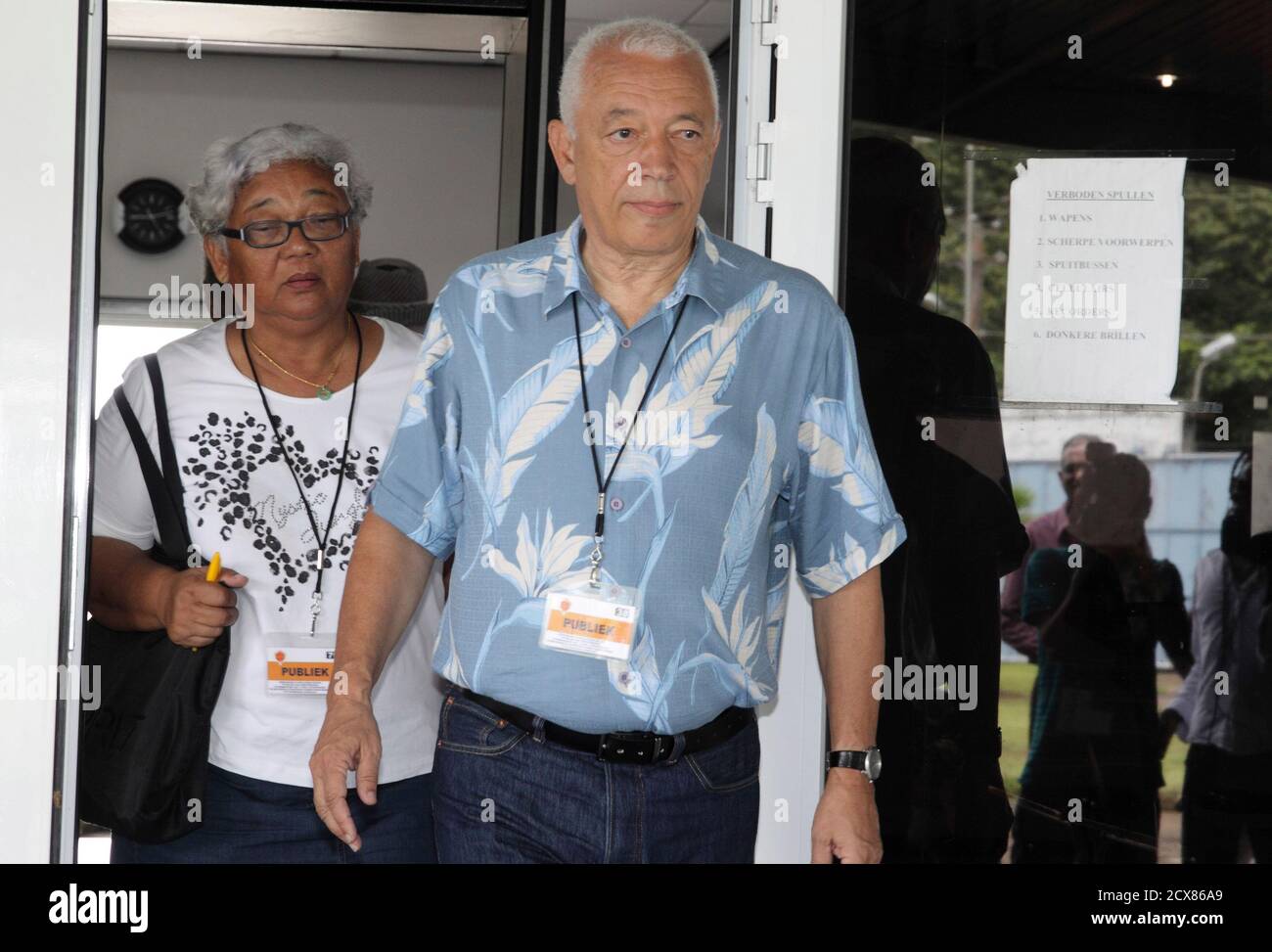 Eddy Wijngaarde, brother of late-Surinamese journalist Frank Wijngaarde,  and Betty Goede, head of the Organization of Justice and Peace, leave a  military court in Para district April 13, 2012, where the majority