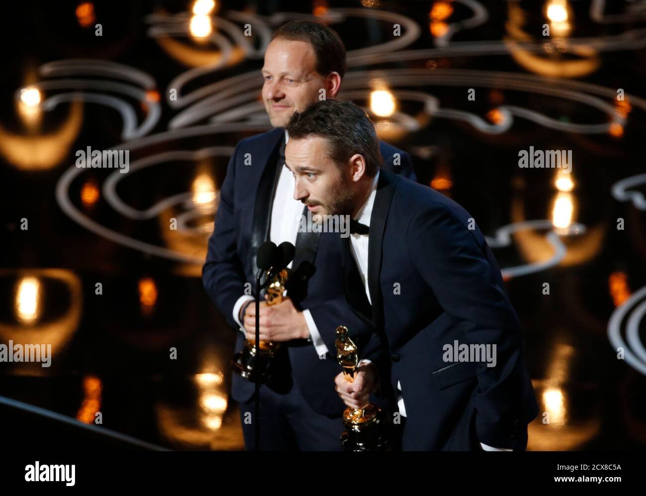 Kim Magnusson (rear) and Anders Walter accept the Oscar for best live  action short film for "Helium" at the 86th Academy Awards in Hollywood,  California March 2, 2014. REUTERS/Lucy Nicholson (UNITED STATES -