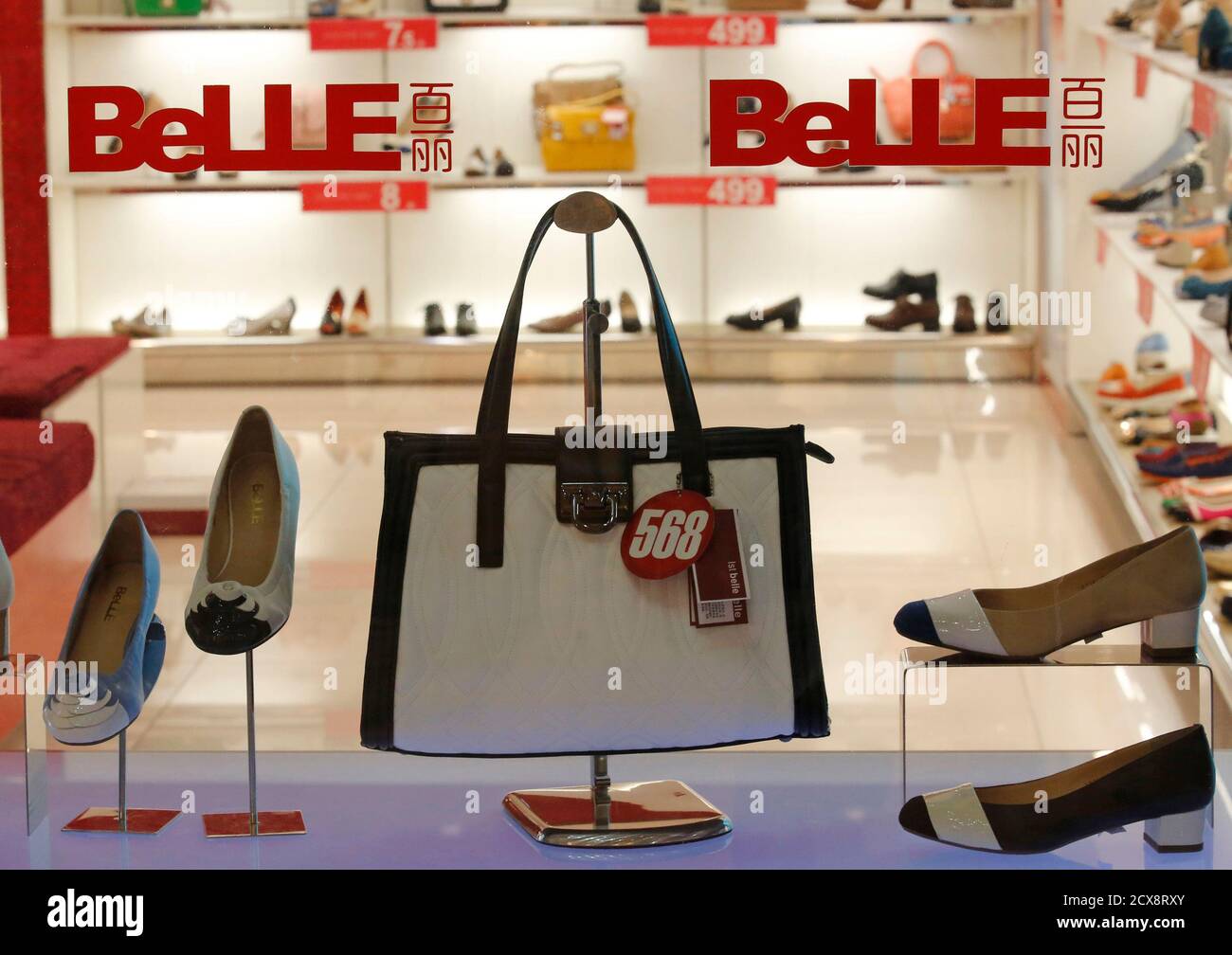 Products of Belle are seen at a show window at its store in Beijing in this  March 25, 2013 file photo. Retail sales grew at the slowest pace in nine  years this
