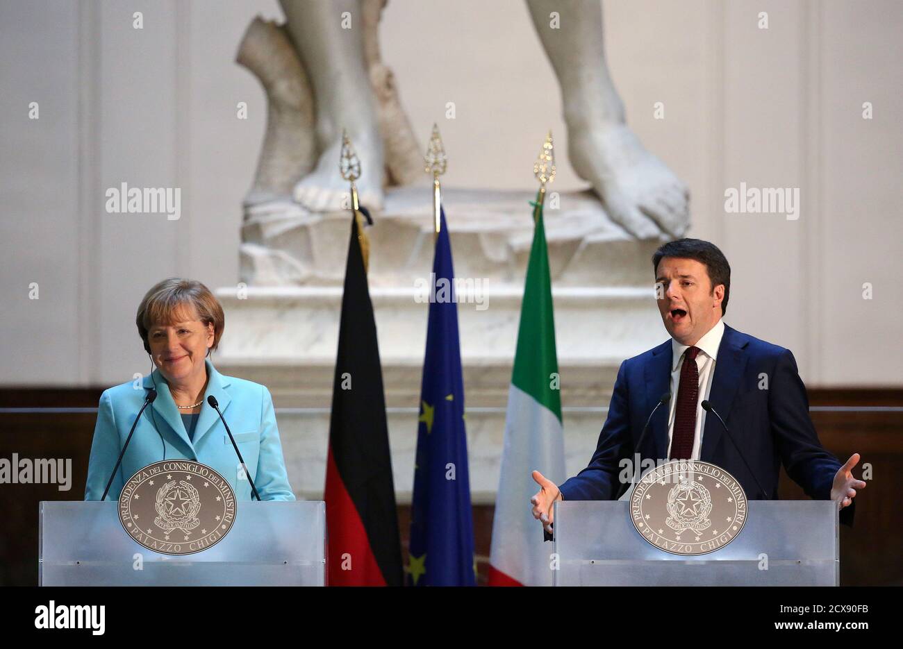 Italy's Prime Minister Matteo Renzi (R) talks during a joint news conference with Germany's Chancellor Angela Merkel at the end of a meeting at the Galleria dell'Accademia in Florence January 23, 2015. REUTERS/Alessandro Bianchi (ITALY - Tags: POLITICS) Stock Photo