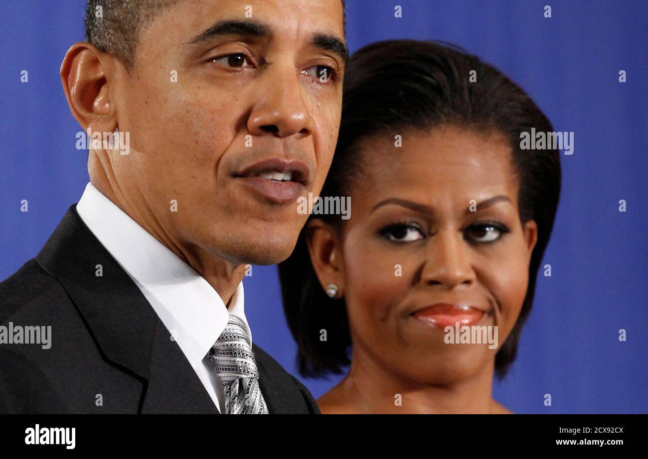 First Lady Michelle Obama Listens As U S President Barack Obama Speaks Before Signing The Healthy Hunger