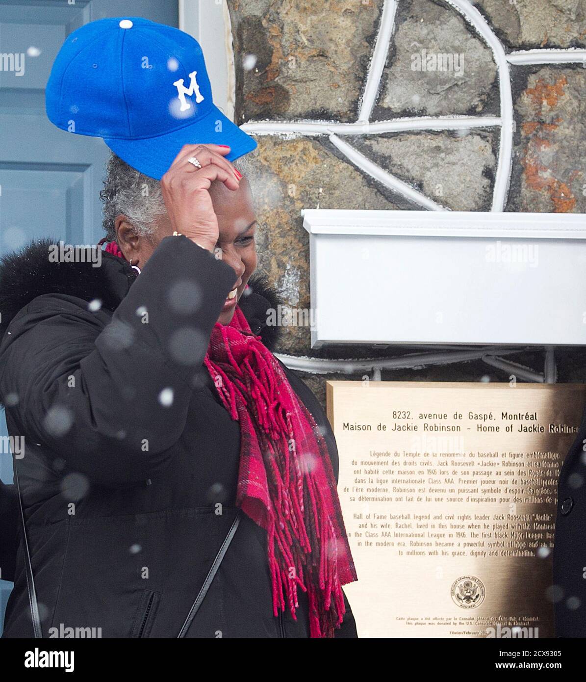 Sharon Robinson takes off a Montreal Royals baseball cap after the  unveiling of a plaque outside the residence that her father Jackie Robinson  called home in Montreal February 28, 2011. Jackie Robinson
