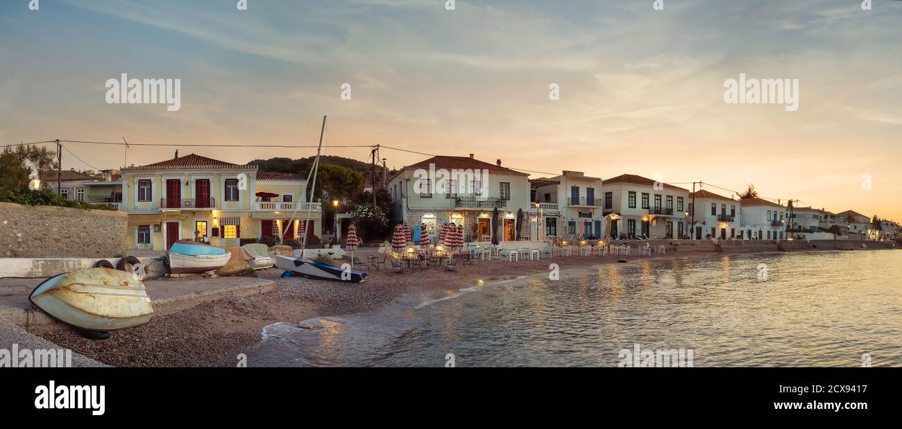 Panoramic view of the coastline, taverns, restaurants and old buildings in Spetses, Greece. Stock Photo