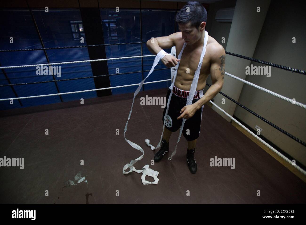 Middleweight champion Sergio Martinez from Argentina removes hand tape  after the boxing training session in Madrid November 23, 2011. Martinez  believes his most realistic chance of winning recognition as the world's  best