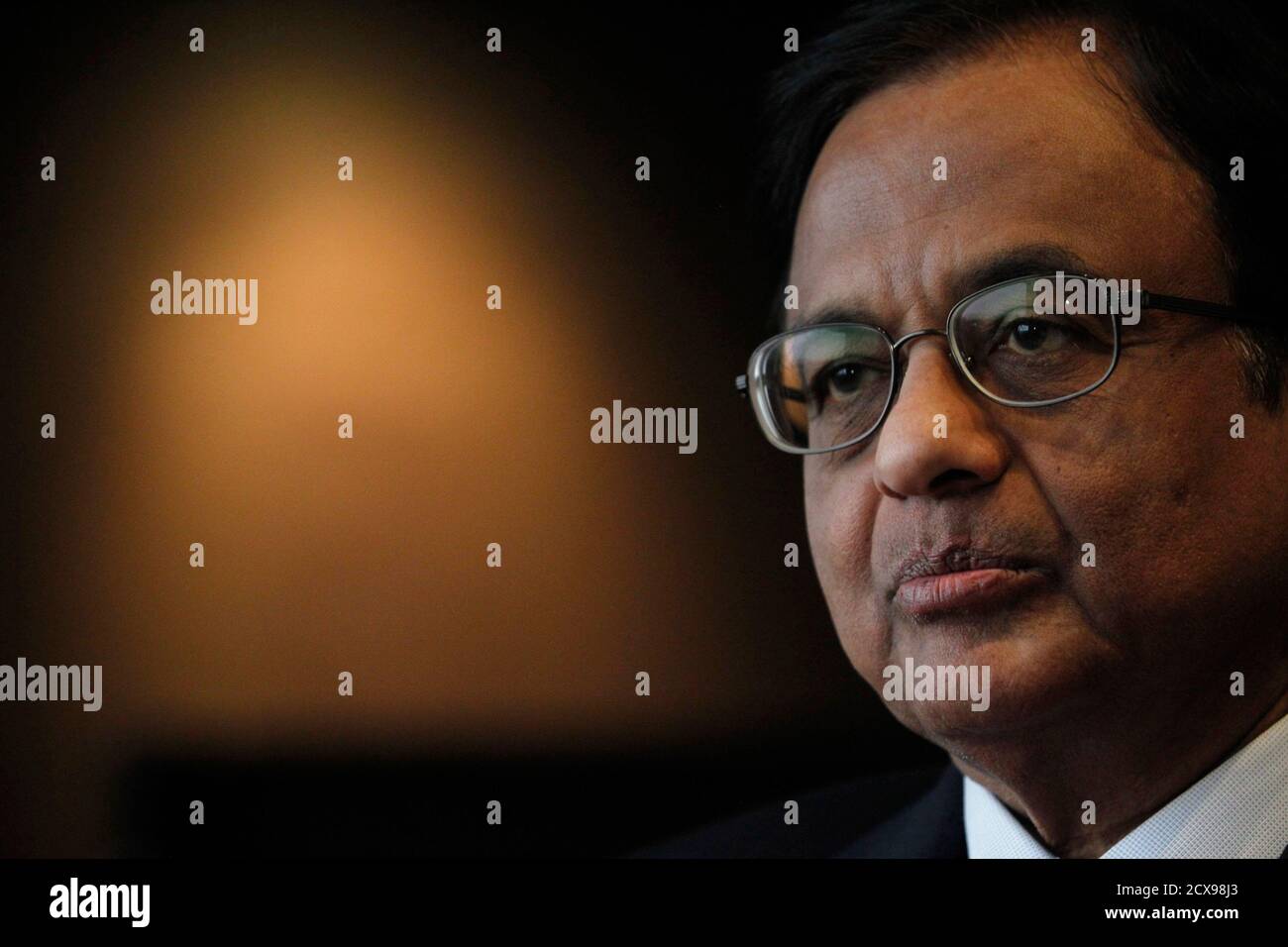 India's Finance Minister P. Chidambaram attends an interview with Reuters at a hotel during his visit for the G20 meeting in Mexico City November 4, 2012. India's economy should expand by 5.5 percent to 6.0 percent this year and growth should then return to 7 percent next year, Chidambaram told Reuters on Sunday, and said inflation was at an 'unacceptable level'. The G20 meeting of finance ministers and central bank governors in Mexico will take place from November 4 to 5. To match Interview INDIA-GDP/ REUTERS/Edgard Garrido (MEXICO - Tags: BUSINESS HEADSHOT POLITICS) Stock Photo