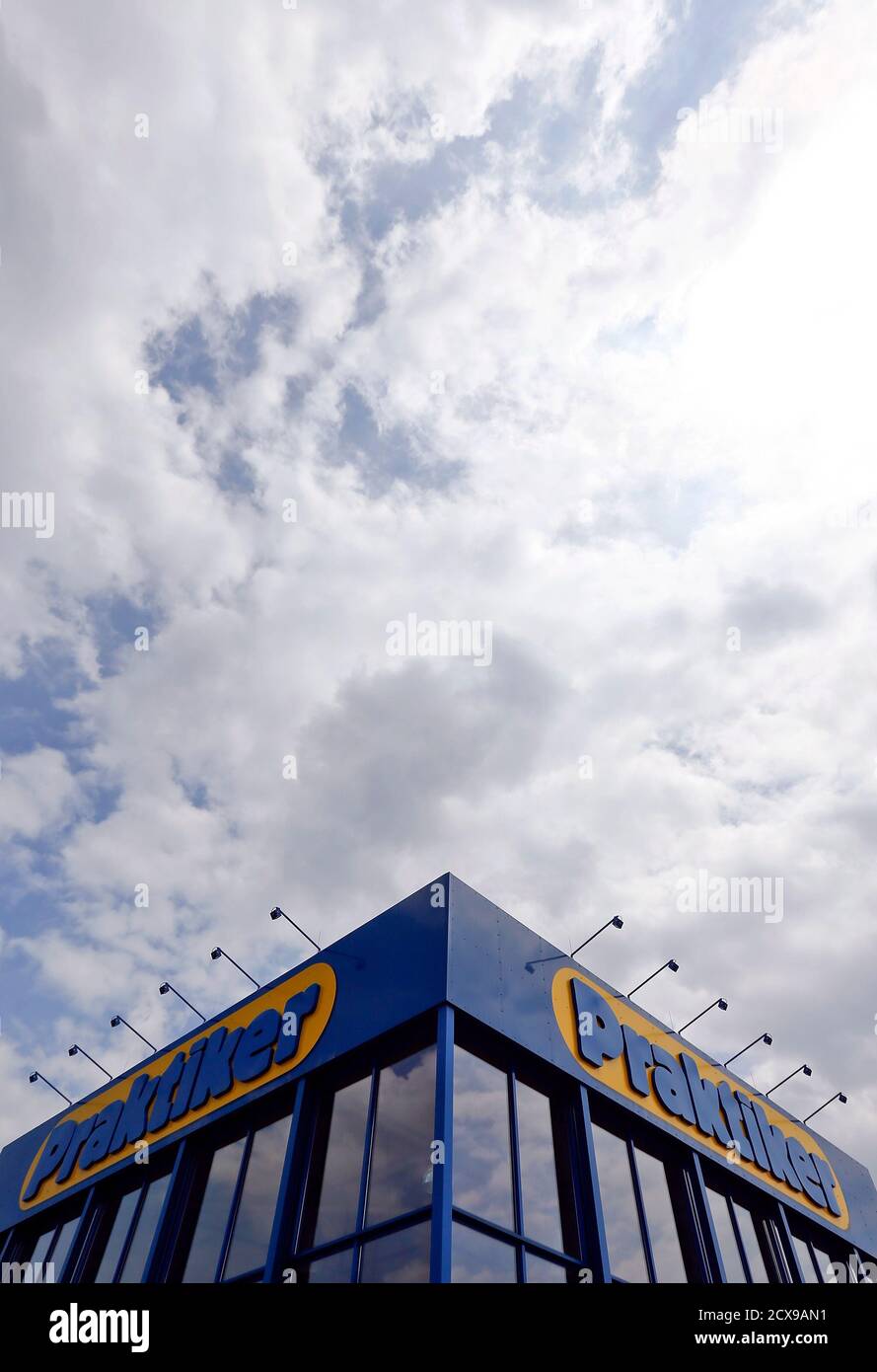 Clouds are pictured above the entrance of German do-it-yourself retailer Praktiker in Munich July 11, 2013. Praktiker said its main home improvement store business in Germany has filed for insolvency on Thursday. The company said that the directors of the businesses that operate Praktiker and extra-BAU+HOBBY stores in Germany asked a Hamburg court to open insolvency proceedings on grounds of over-indebtedness.   REUTERS/Michael Dalder   (GERMANY - Tags: BUSINESS) Stock Photo