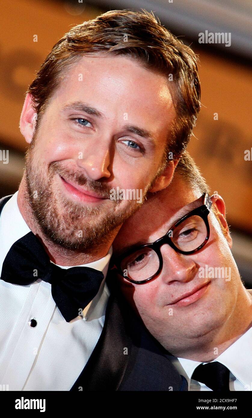 Director Nicolas Winding Refn (R) and cast member Ryan Gosling pose during red carpet arrivals for the film 'Drive', in competition at the 64th Cannes Film Festival, May 20, 2011.                       REUTERS/Yves Herman (FRANCE - Tags: ENTERTAINMENT) Stock Photo
