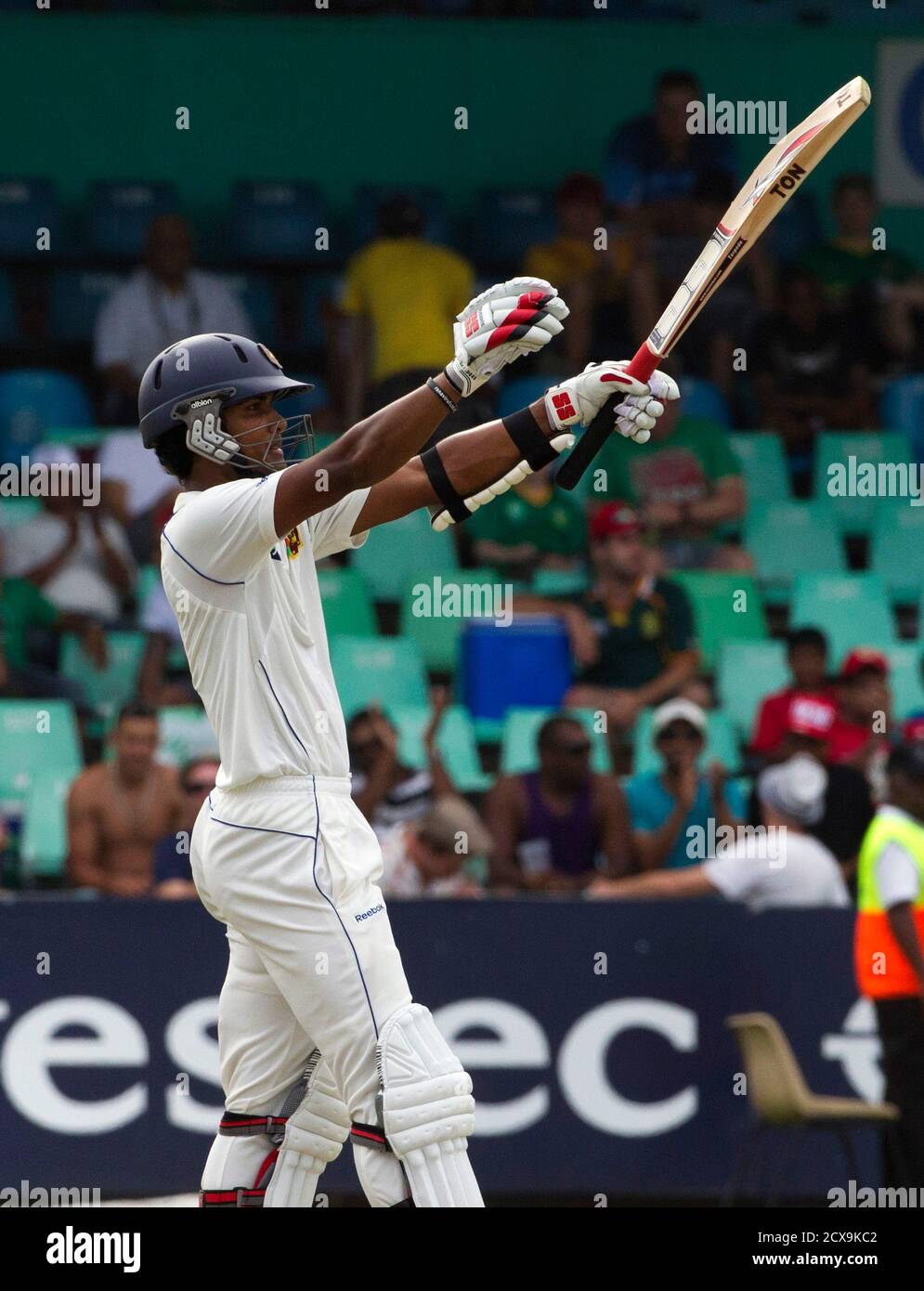Sri Lanka's Dinesh Chandimal celebrates scoring a half century during their test cricket match against South Africa in Durban December 26, 2011. REUTERS/Rogan Ward (SOUTH AFRICA - Tags: SPORT CRICKET) Stock Photo