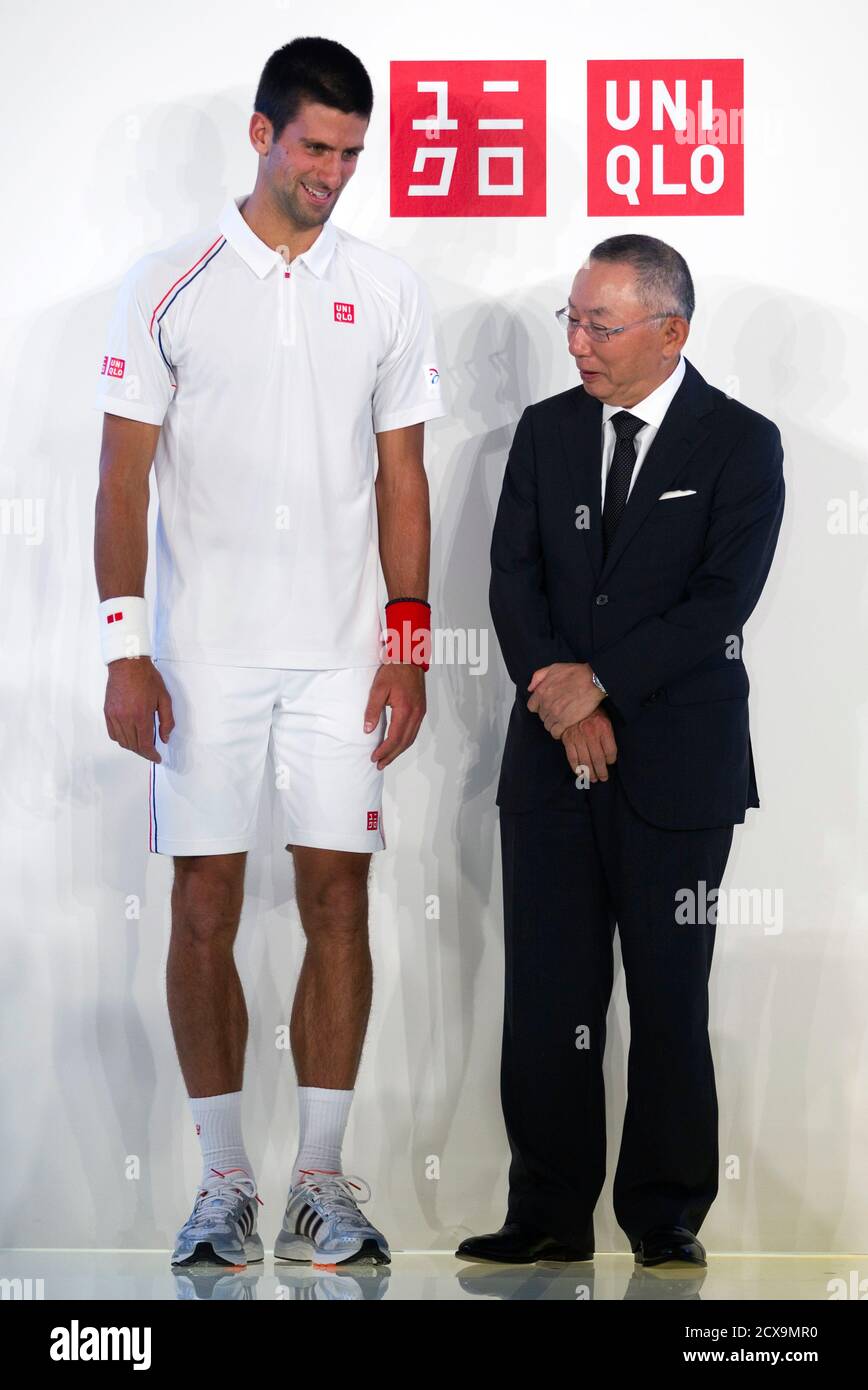 Tennis player Novak Djokovic of Serbia (L) and Tadashi Yanai, chairman and  chief executive of Fast Retailing Co, pose as they attend the presentation  of a new sponsorship deal with Uniqlo budget