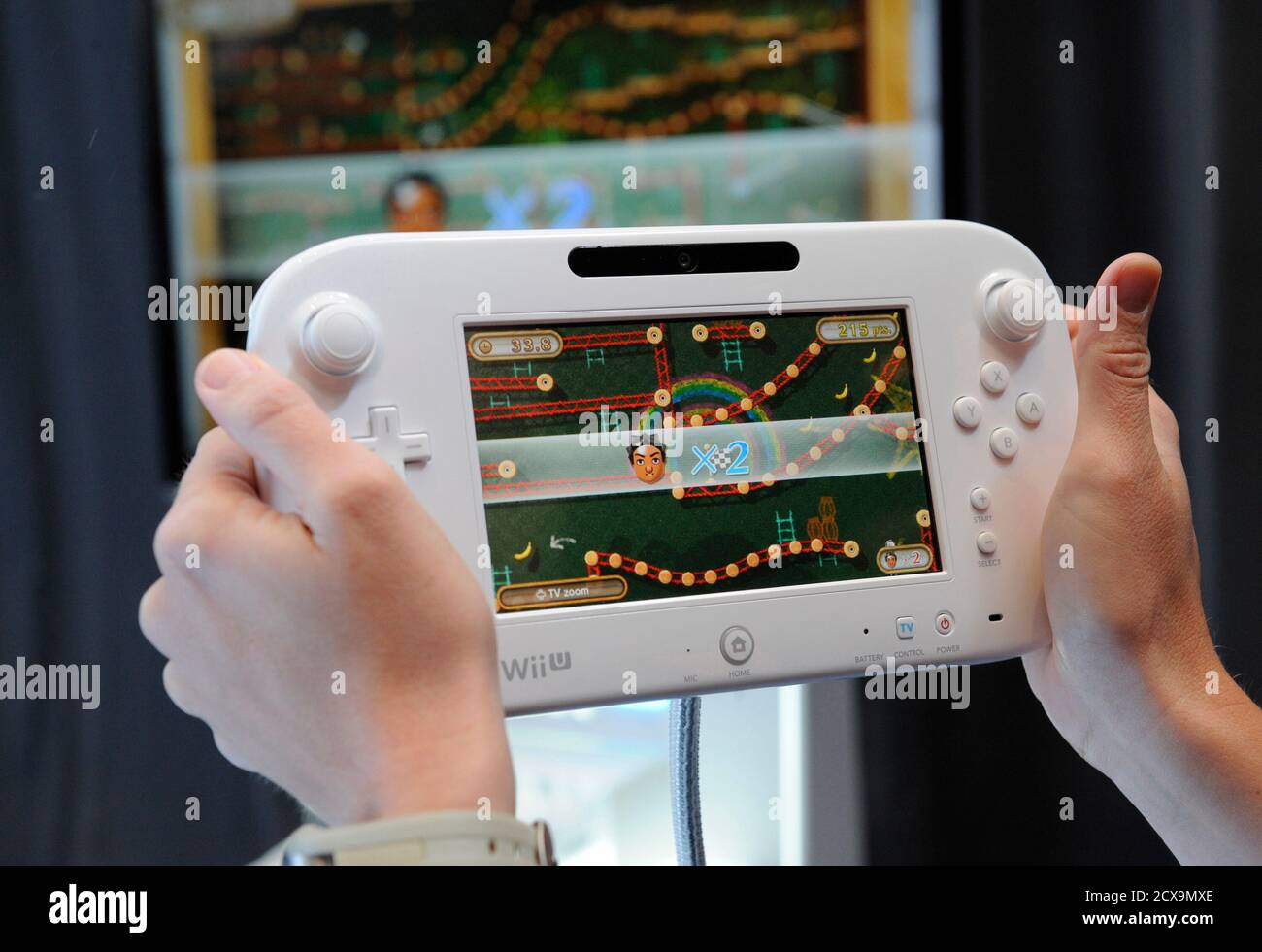 Attendees participate in a demonstration of the new Wii U GamePad and  Console following the Nintendo All-Access Presentation at E3 2012, the  Electronic Entertainment Expo, in Los Angeles June 5, 2012. Nintendo