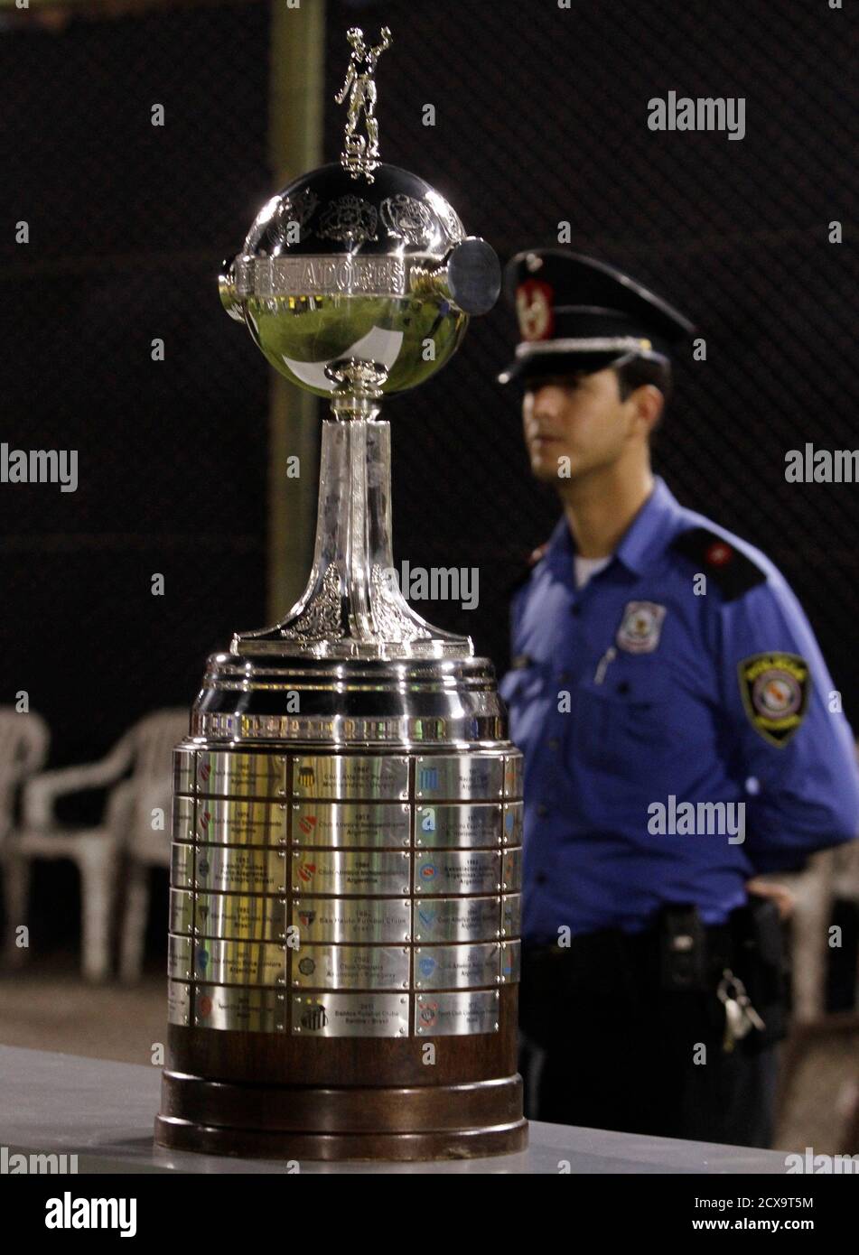 A Policeman Guards The Copa Libertadores Trophy Before Paraguay S Olimpia Plays Brazil S Atletico Mineiro In The Copa Libertadores First Leg Final Soccer Match In Asuncion July 17 2013 Reuters Jorge Adorno Paraguay