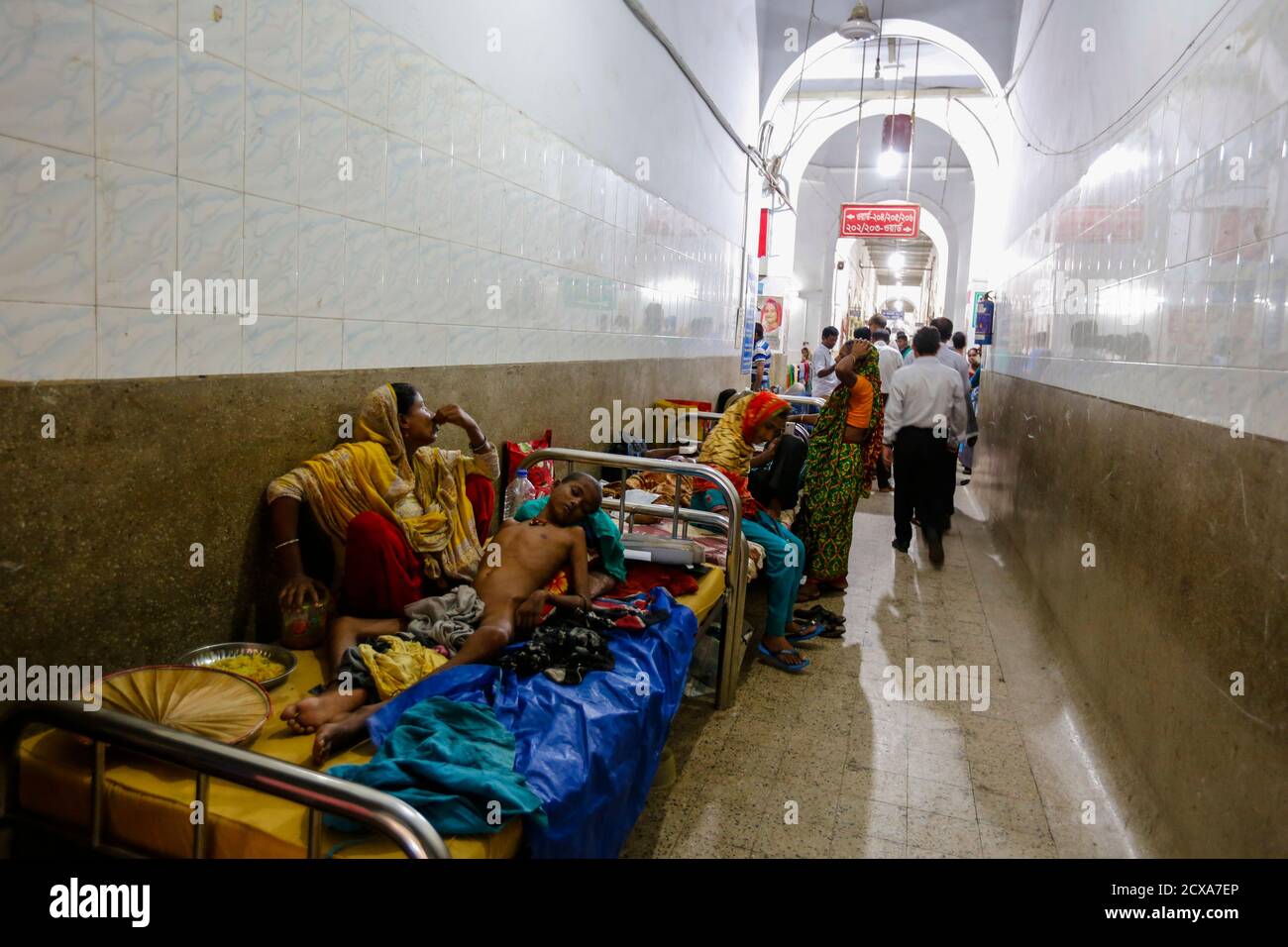 The Dhaka Medical College Hospital struggles to handle the rush of patients five times beyond its capacity. As a result, patients and their attendees Stock Photo