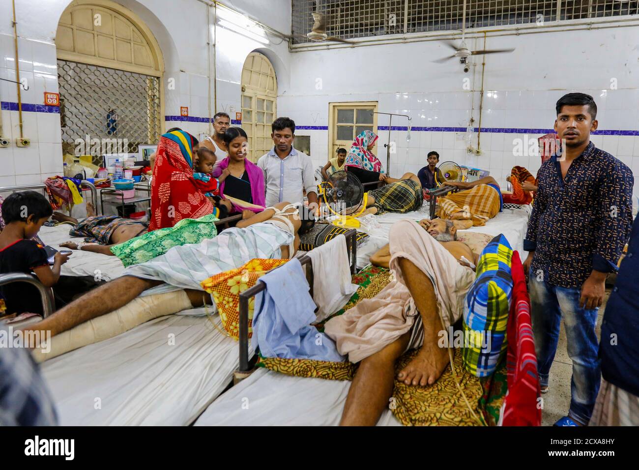 The Dhaka Medical College Hospital struggles to handle the rush of patients five times beyond its capacity. As a result, patients and their attendees Stock Photo