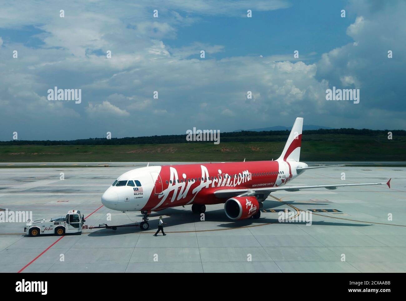 Air Asia aircraft model 9M-AQB is seen on track at Low Cost Carrier  Terminal (LCCT) airport at Sepang outside Kuala Lumpur November 19, 2013.  Malaysia's AirAsia Bhd will take up to two