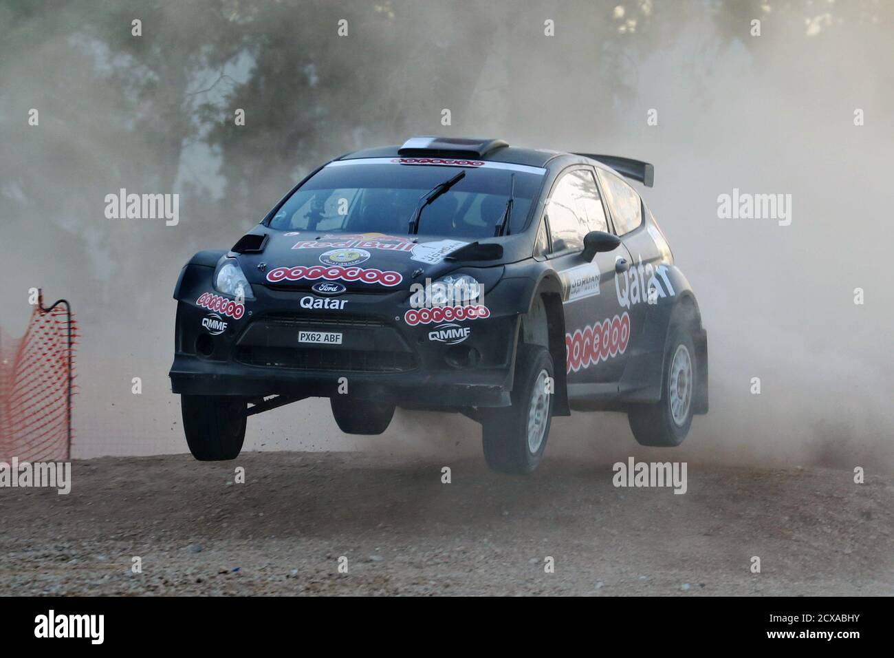 Nasser Saleh Al-Attiyah of Qatar and co-driver Giovanni Bernacchini drive their Ford Fiesta RRC during the gravel super special stage of the 2014 Jordan Rally, the third round of the Middle East Rally Championship (MERC), in Amman May 1, 2014. REUTERS/Muhammad Hamed (JORDAN - Tags: SPORT MOTORSPORT) Stock Photo
