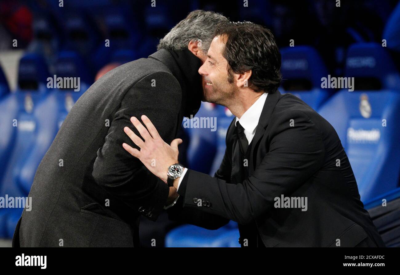 Real Madrid's coach Jose Mourinho (L) greets Atletico Madrid's coach Quique Sanchez Flores prior to their Spanish King's Cup quarter-final first leg match at the Santiago Bernabeu stadium in Madrid, January 13, Real Madrid's coach Jose Mourinho (L) greets Atletico Madrid's coach Quique Sanchez Flores prior to their Spanish King's Cup quarter-final first leg match at the Santiago Bernabeu stadium in Madrid, January 13,