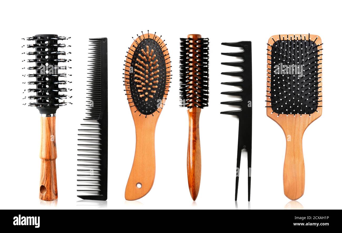 Hair brushes and combs on white background Stock Photo