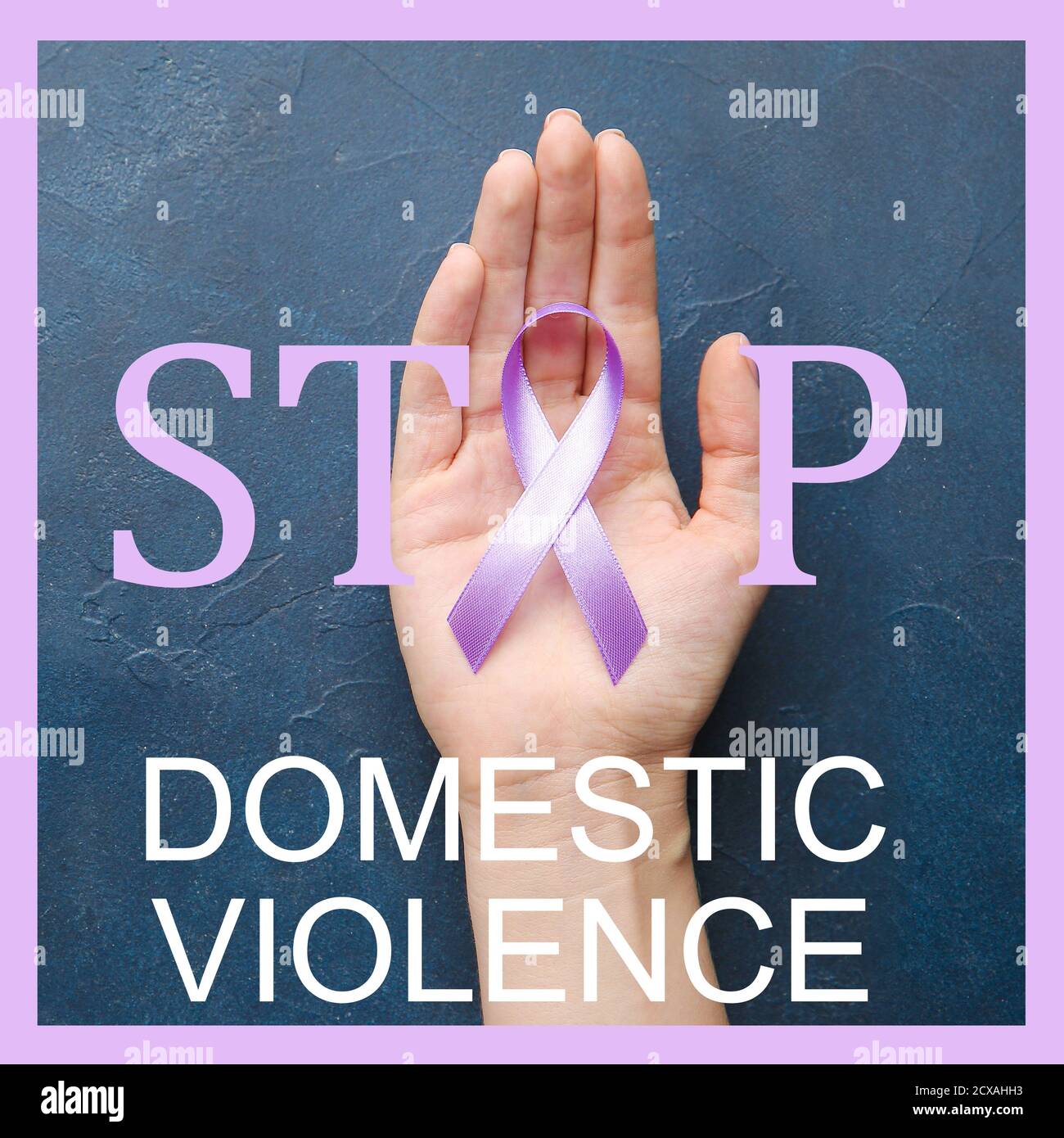 Female hand with purple ribbon and text STOP DOMESTIC VIOLENCE on color background Stock Photo