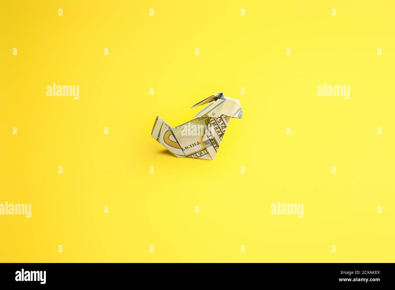 Origami rabbit made of dollar banknote on color background Stock Photo ...