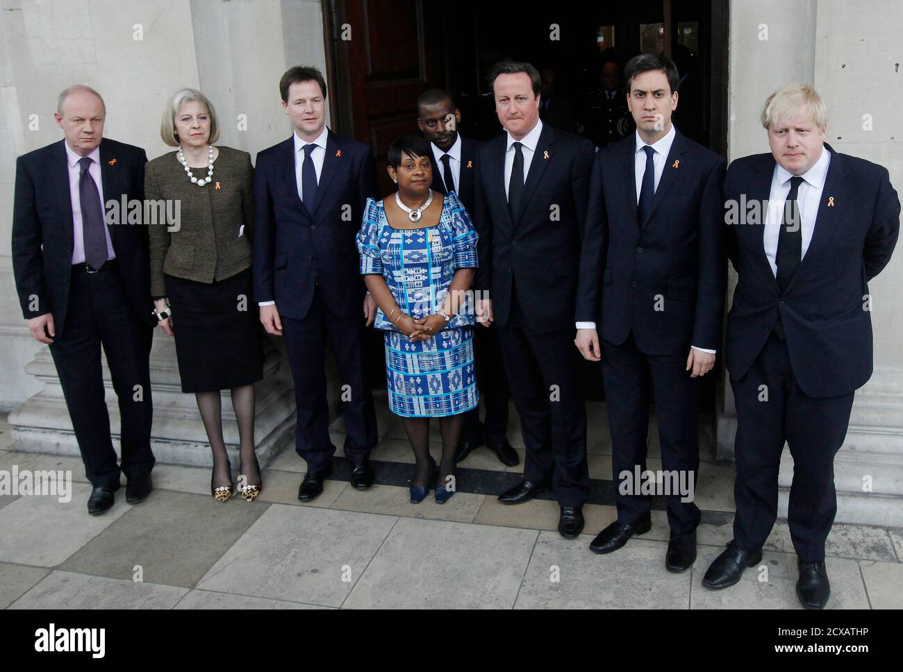 The mother of murdered teenager Stephen Lawrence, Doreen Lawrence, poses for a photograph with (L-R) Minister for Policing and Criminal Justice, Damian Green, Home Secretary Theresa May, Deputy Prime Minister Nick Clegg, Doreen Lawrence, Stephen's brother Stuart, Britain's Prime Minister David Cameron, Labour Party Leader Ed Milliband and London Mayor Boris Johnson after a service to mark the 20th anniversary of Stephen's death, at St Martin-in-the-Fields church in London April 22, 2013.    REUTERS/Luke MacGregor  (BRITAIN - Tags: CRIME LAW POLITICS SOCIETY RELIGION) Stock Photo