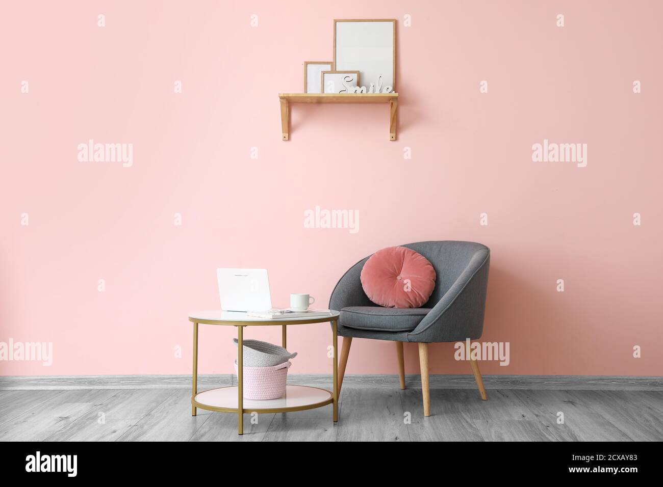 Interior of modern room with table and armchair Stock Photo - Alamy