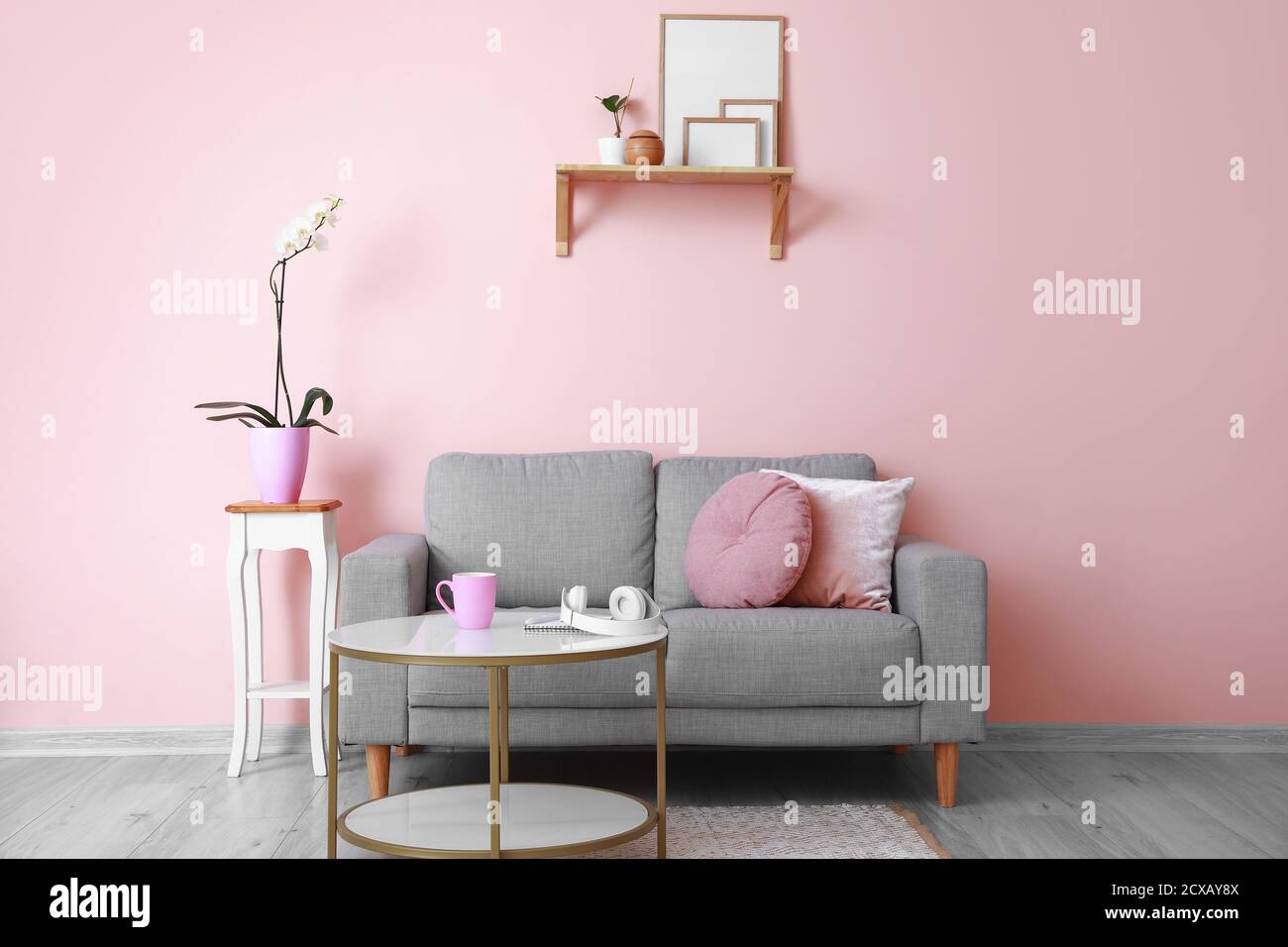 Interior of modern room with sofa and table Stock Photo - Alamy