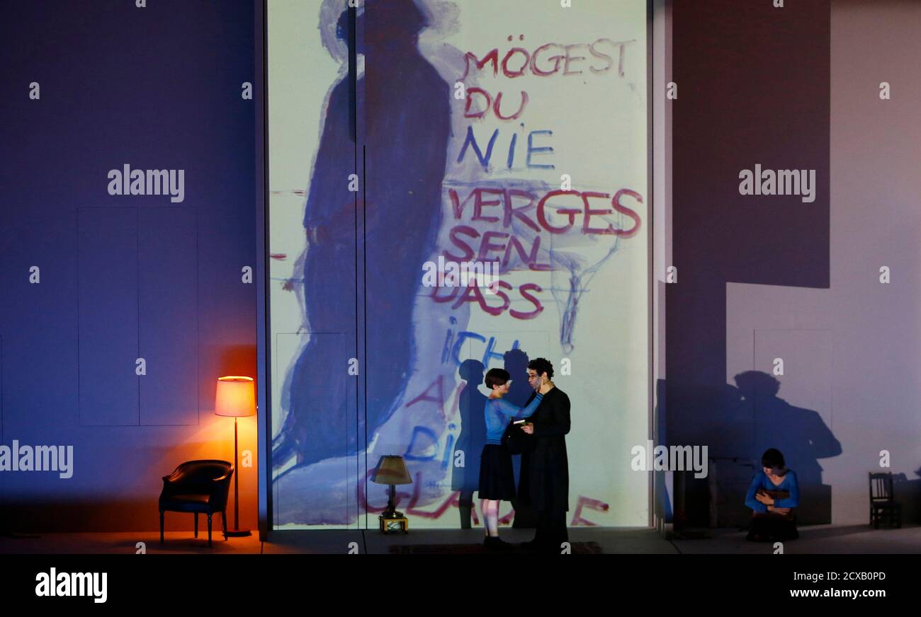 Singers Frederic Antoun as Amadeus Daberlohn and Marianne Crebassa as  Charlotte Kann perform on stage during a dress rehearsal of Marc-Andre  Dalbavie's opera 'Charlotte Salomon' in Salzburg July 24, 2014. The opera