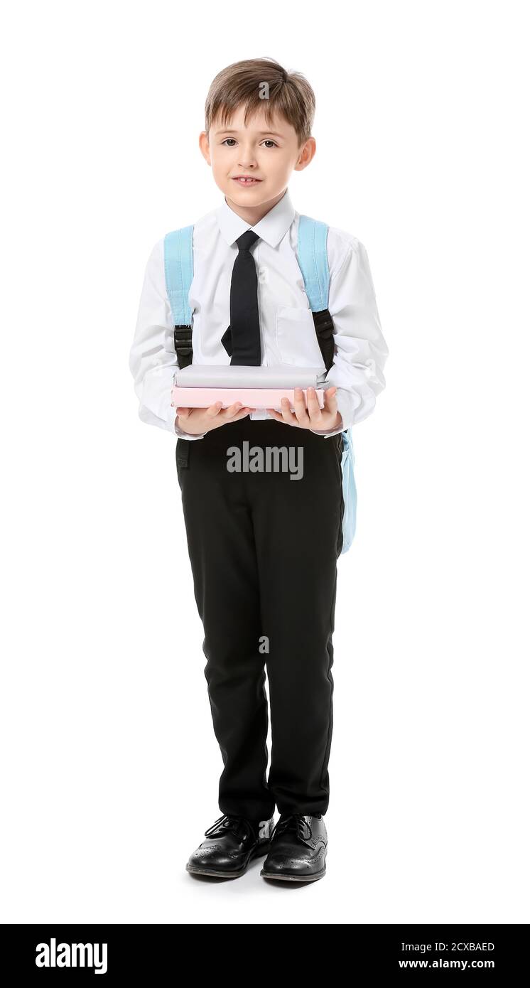 Little schoolboy with books on white background Stock Photo - Alamy