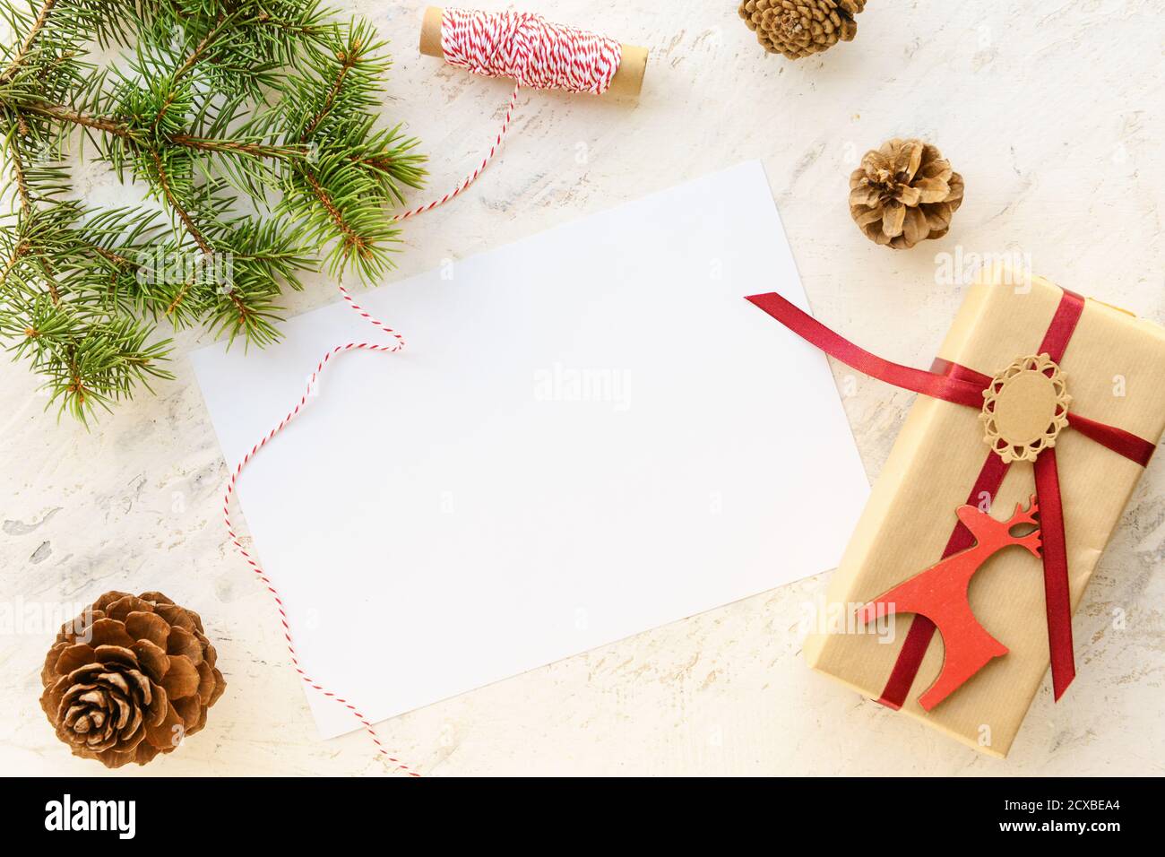Beautiful Christmas gift with empty card on white background Stock ...