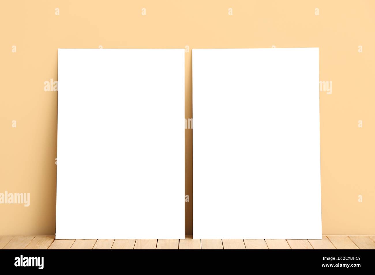 Blank posters near color wall Stock Photo Alamy