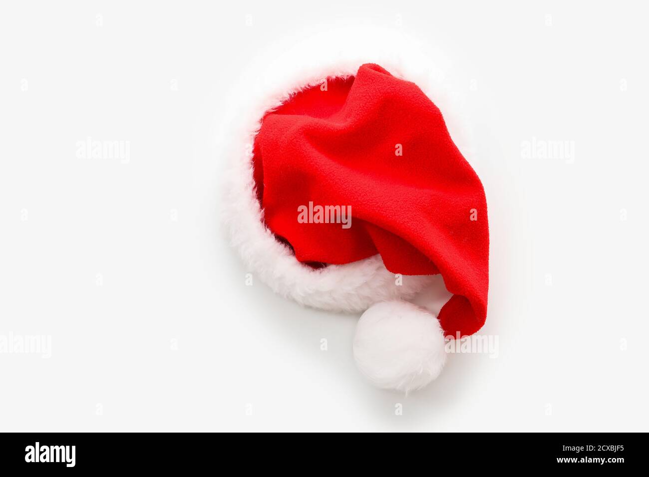Santa Claus hat on white background Stock Photo - Alamy