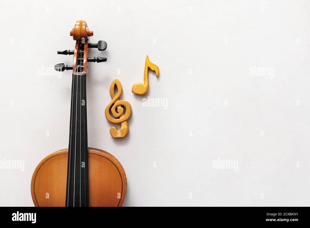 Violin with music notes on white background Stock Photo - Alamy