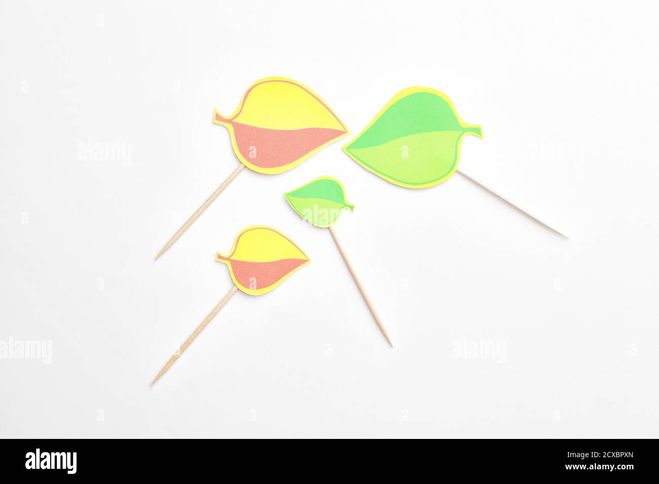 Stylish cupcake toppers on white background Stock Photo - Alamy