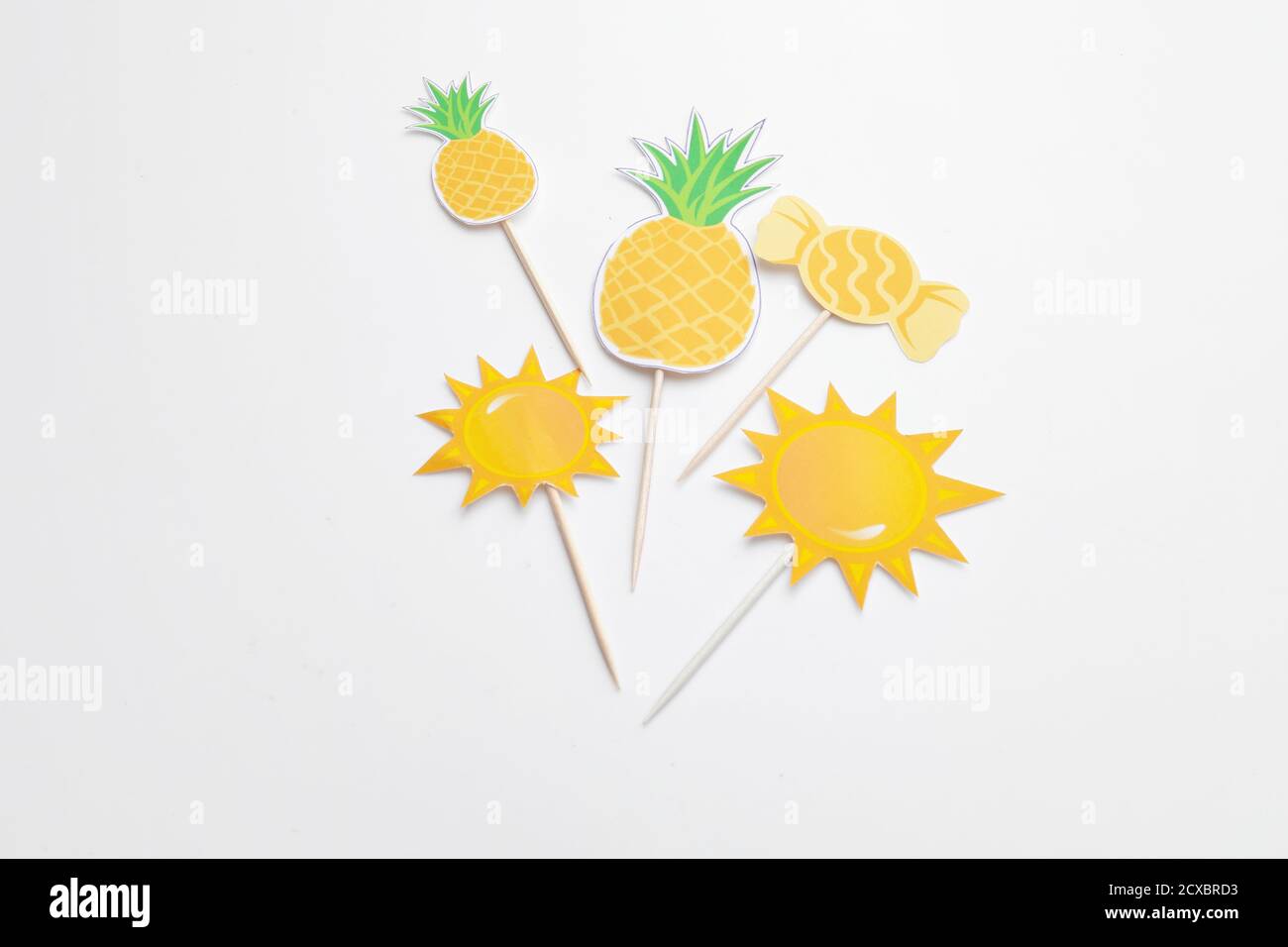 Stylish cupcake toppers on white background Stock Photo - Alamy
