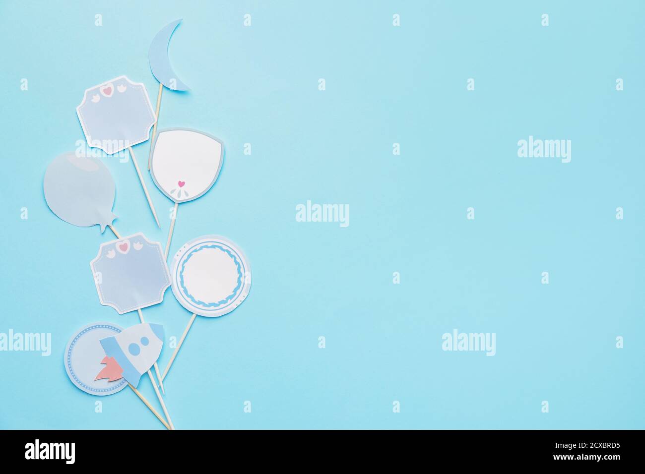 Stylish cupcake toppers on color background Stock Photo - Alamy