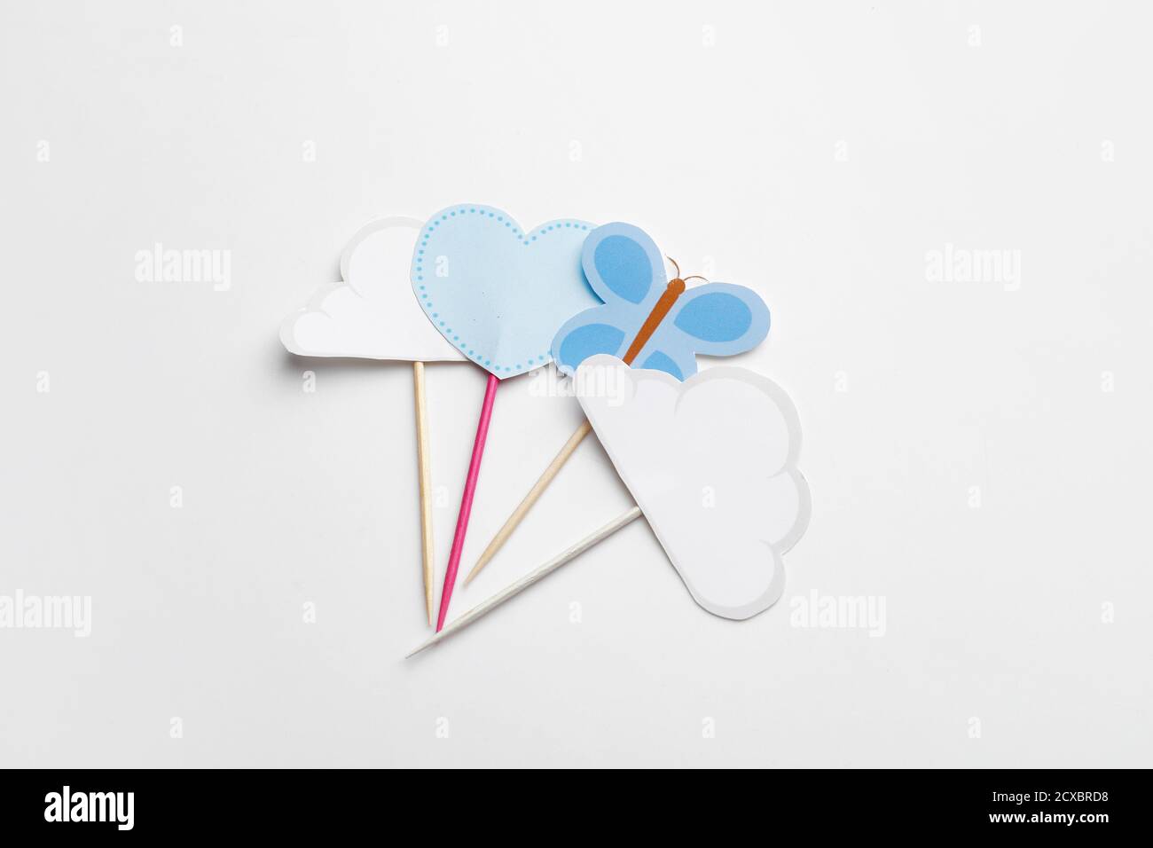 Stylish cupcake toppers on white background Stock Photo - Alamy