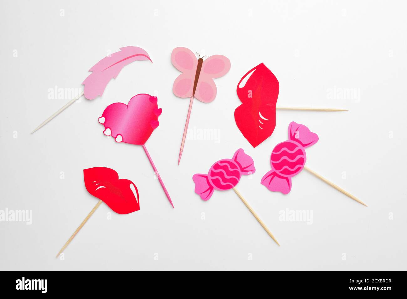 Stylish cupcake toppers on white background Stock Photo - Alamy