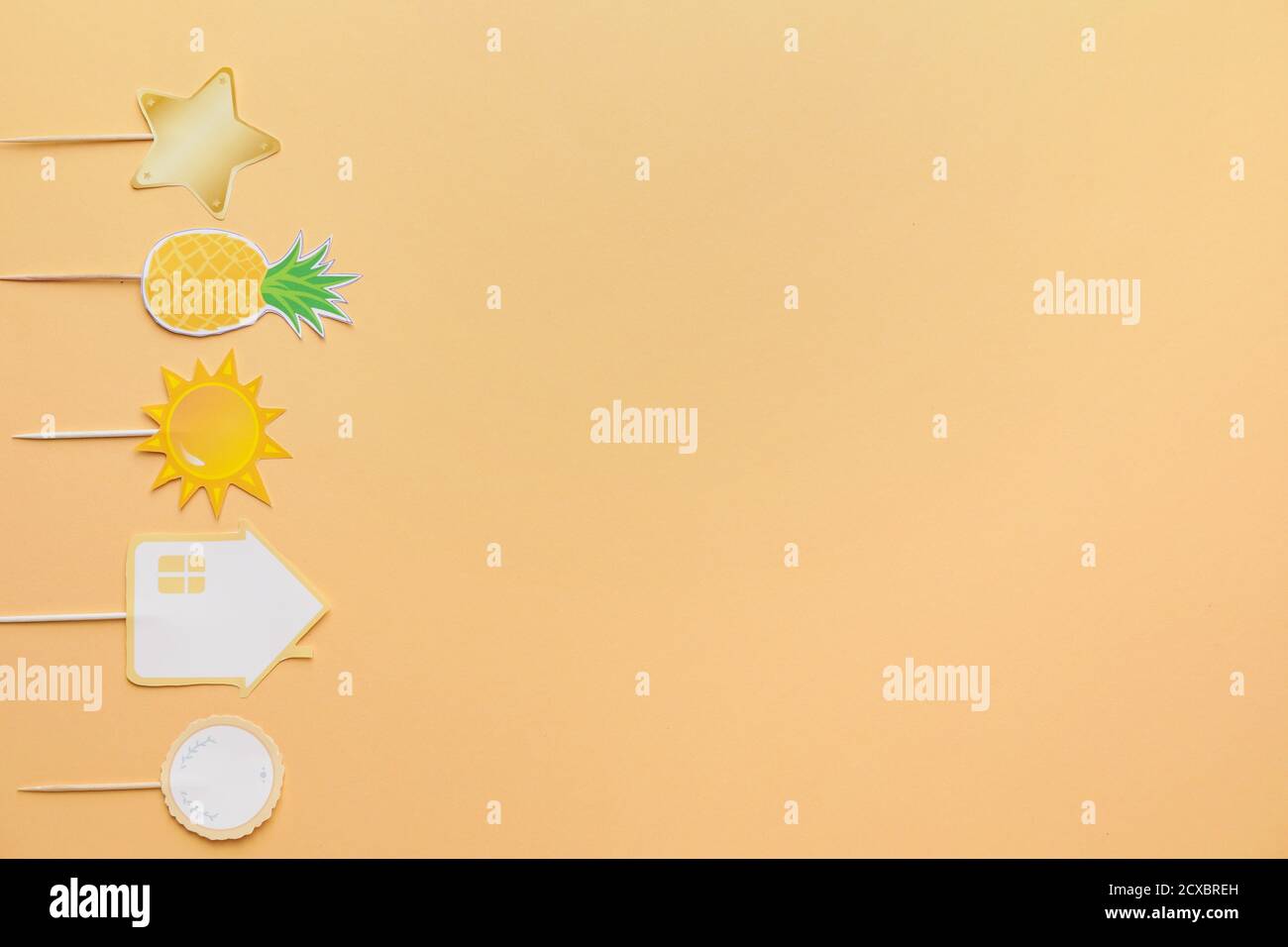 Stylish cupcake toppers on color background Stock Photo - Alamy