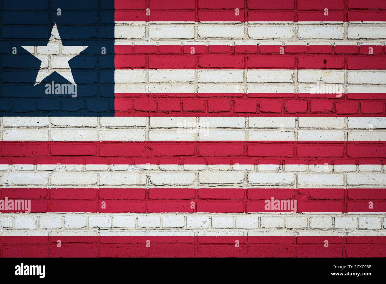 National flag of Liberia depicting in paint colors on an old brick wall ...