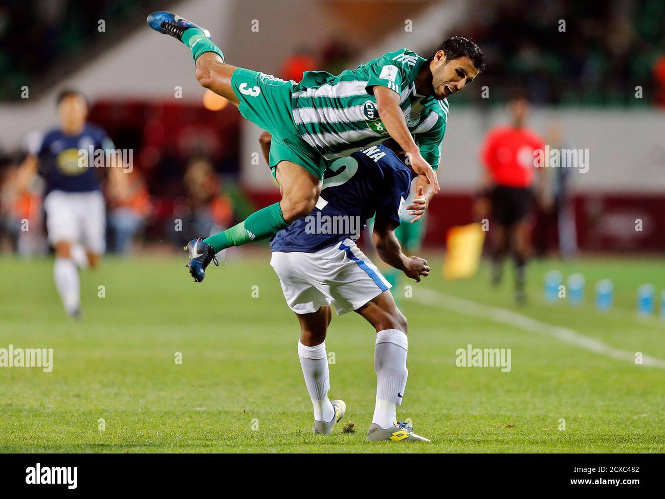 Zakaria El Hachimi Top Of Raja Casablanca Fights For The Ball With Roy Krishna Of Auckland City Fc During Their Fifa Club World Cup Soccer Match At Agadir Stadium In Agadir December